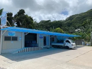Hidden Spring factory exterior in Au Cap with delivery bay, bottled water and company signage